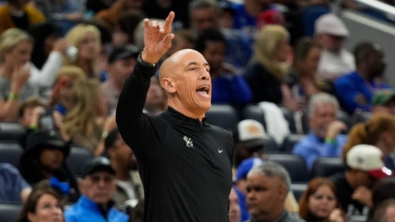 Sacramento Kings head coach Doug Christie directs players on the court during the first half of an NBA basketball game against the Orlando Magic, Saturday, March 29, 2025, in Orlando, Fla. (John Raoux/AP)