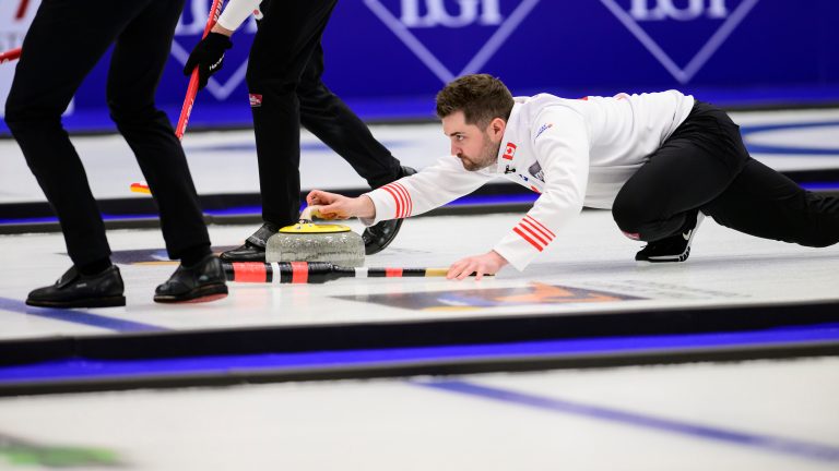Canada's Matt Dunstone delivers the rock during a gold medal match against Sweden at the curling world championships, Saturday, April 4, 2026, in Ogden, Utah. (AP Photo/Tyler Tate)