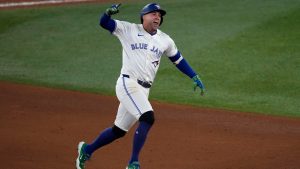 Toronto Blue Jays' George Springer celebrates his three run home run against the Seattle Mariners during the seventh inning in Game 7 of baseball's American League Championship Series, Monday, Oct. 20, 2025, in Toronto. (AP/David J. Phillip)