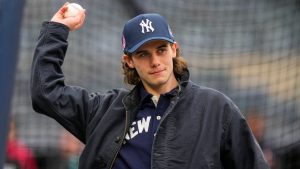 New Jersey Devils' Jack Hughes practices ahead of his first pitch before a home-opener baseball game between the New York Yankees and the Miami Marlins, Friday, April 3, 2026, in New York. (Yuki Iwamura/AP)