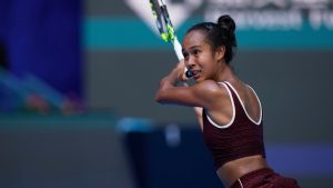 Leylah Fernandez of Canada plays a backhand return to Coco Gauff of the United States during a women's singles match of the China Open tennis tournament, at the National Tennis Center, in Beijing, China, Sunday, Sept. 28, 2025. (Mahesh Kumar A./AP)