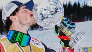 Canada's Reece Howden kisses the crystal globe for the men's ski cross World Cup discipline, in Gällivare, Sweden, Sunday, March 29, 2026. (Anders Wiklund/TT News Agency via AP)