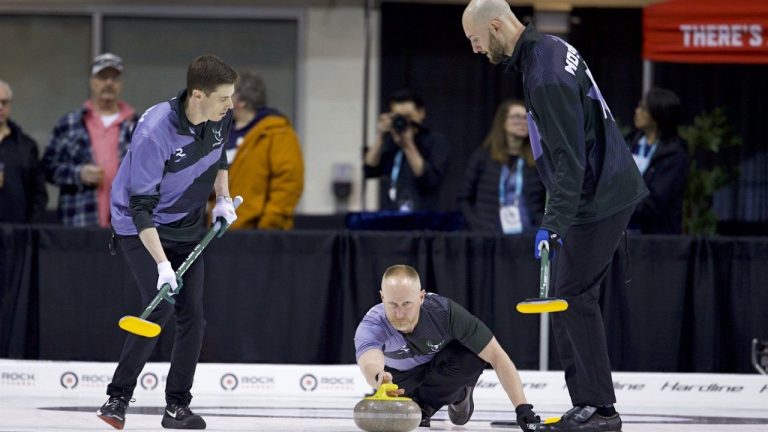 Team Shield skip Brad Jacobs delivers a stone with teammates Amos Mosaner and Dan Marsh ready to sweep in this handout photo, during a Rock League curling game against Team Alpine at Toronto's Mattamy Athletic Centre, on Monday, April 6, 2026. (THE CANADIAN PRESS/Handout — The Curling Group, Anil Mungal)