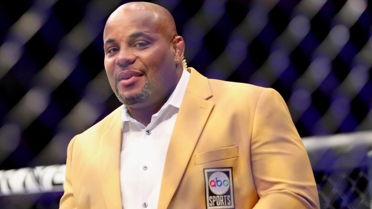 UFC Hall of Famer, commentator and former two-weight champion Daniel Cormier is seen in the cage at a UFC event following a fighter interview. (Gregory Payan/AP)