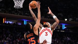 Toronto Raptors forward Brandon Ingram (3) shoots over New York Knicks guard Mikal Bridges (25) during the first half of an NBA basketball game, Friday, April 10, 2026, in New York. (AP Photo/Yuki Iwamura)